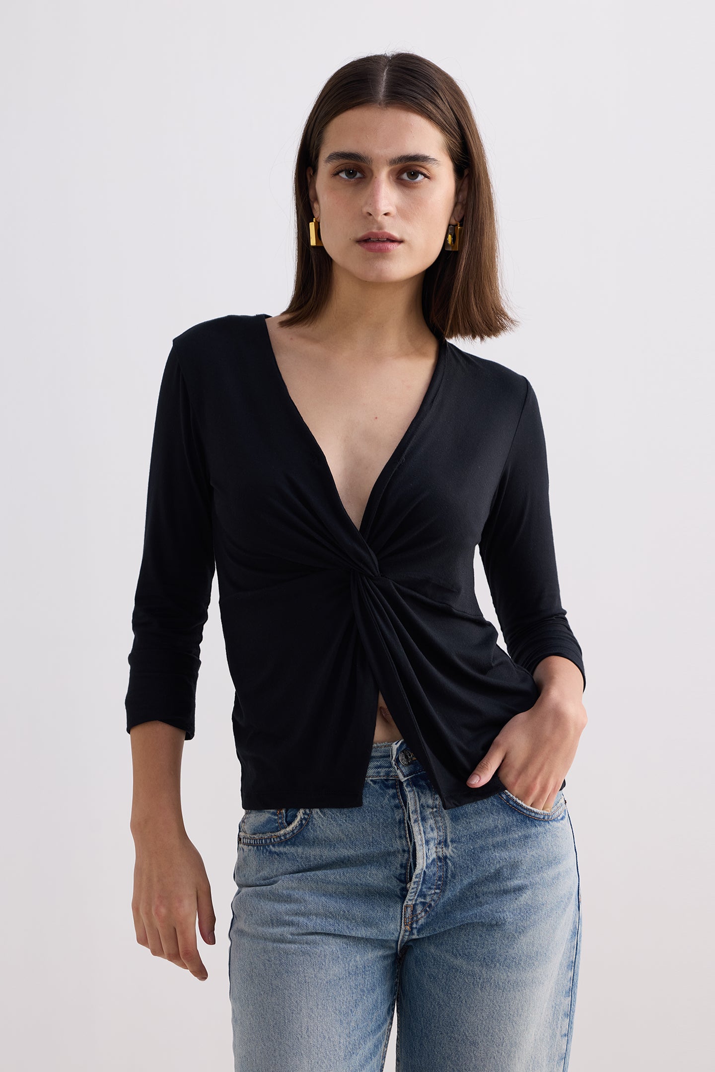 Twist Front Knit Shirt in Black Longshot