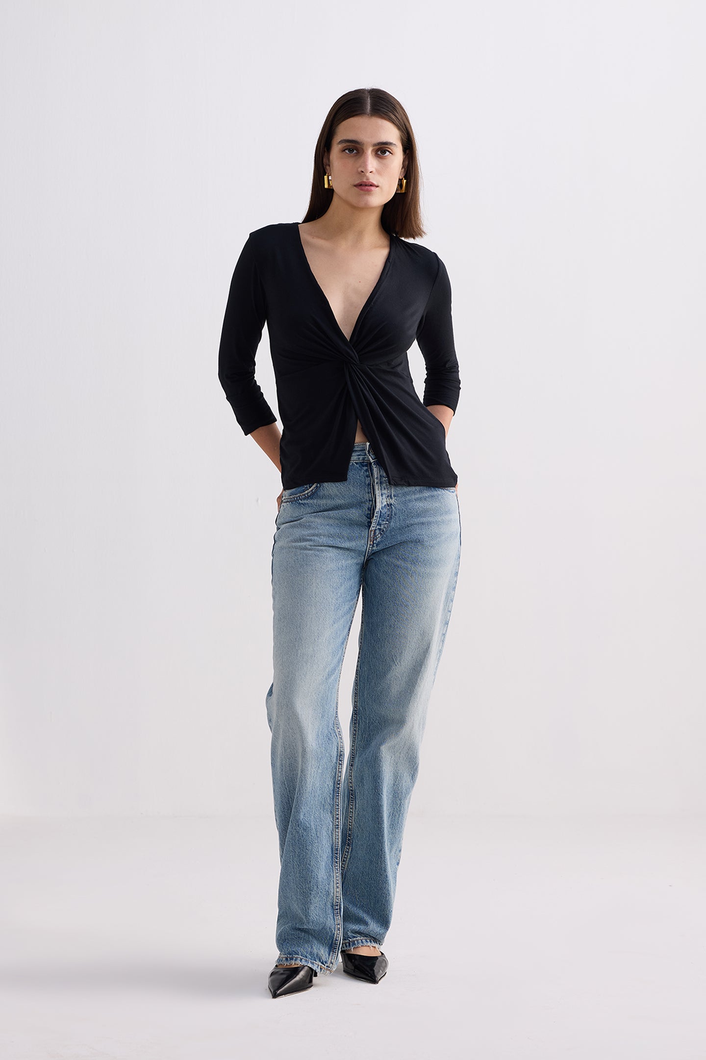 Twist Front Knit Shirt in Black Longshot