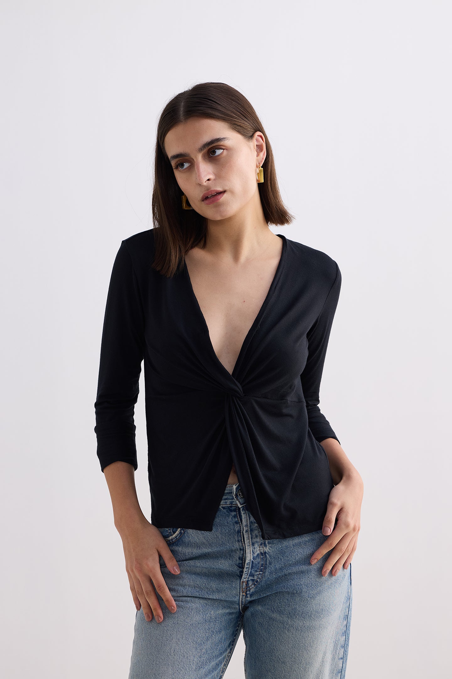 Twist Front Knit Shirt in Black Longshot