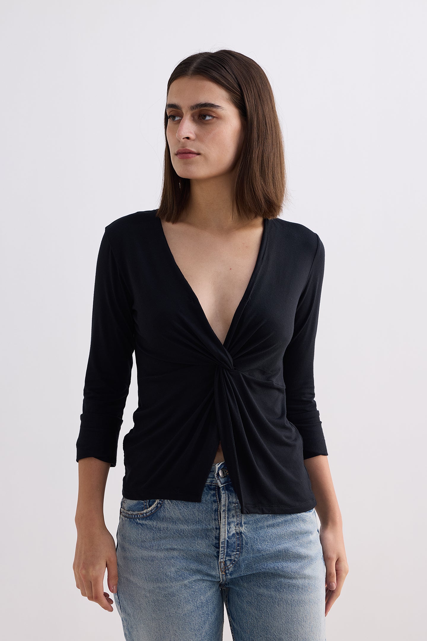 Twist Front Knit Shirt in Black Longshot