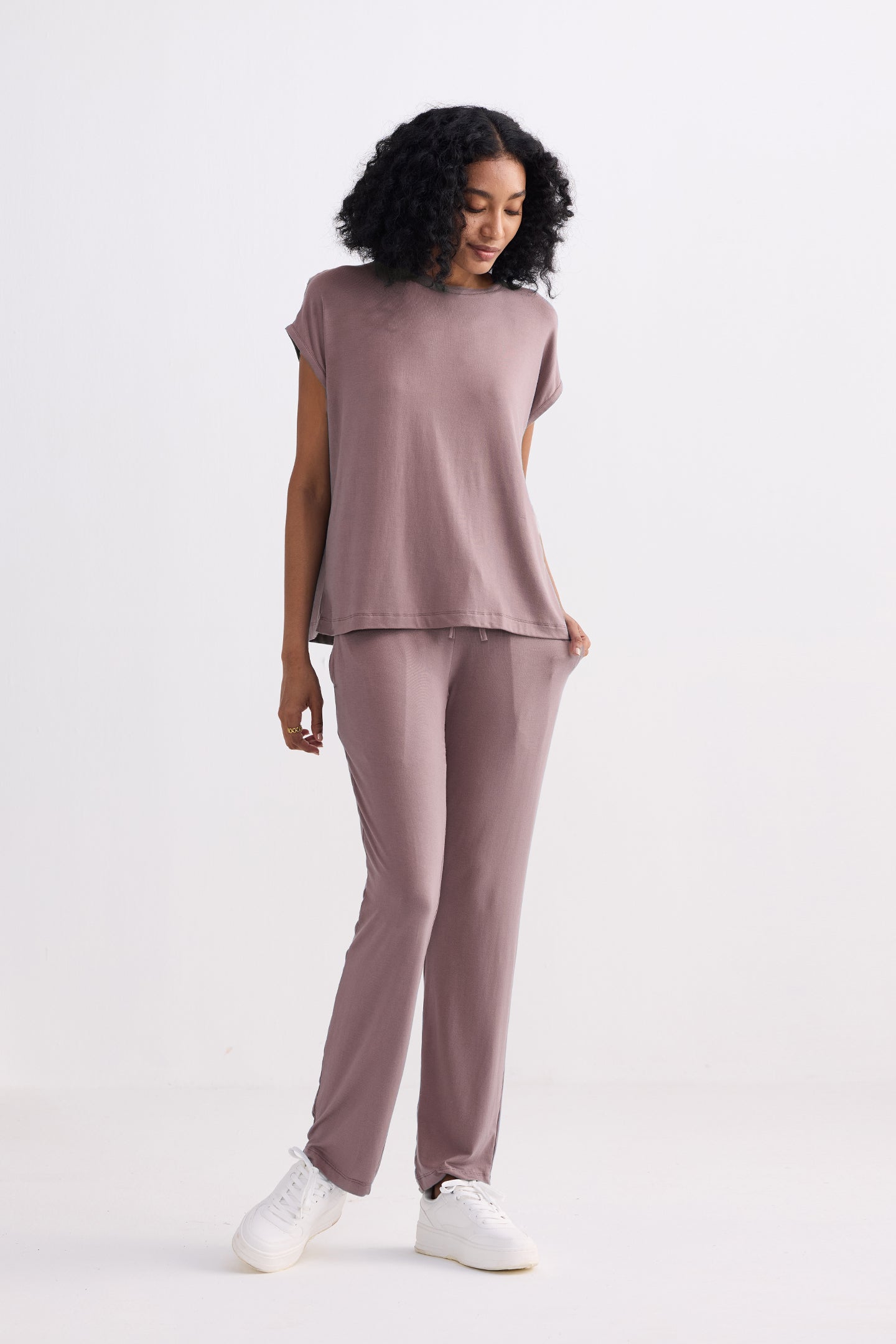 woman wearing dusty rose wide leg pants with sleeveless top