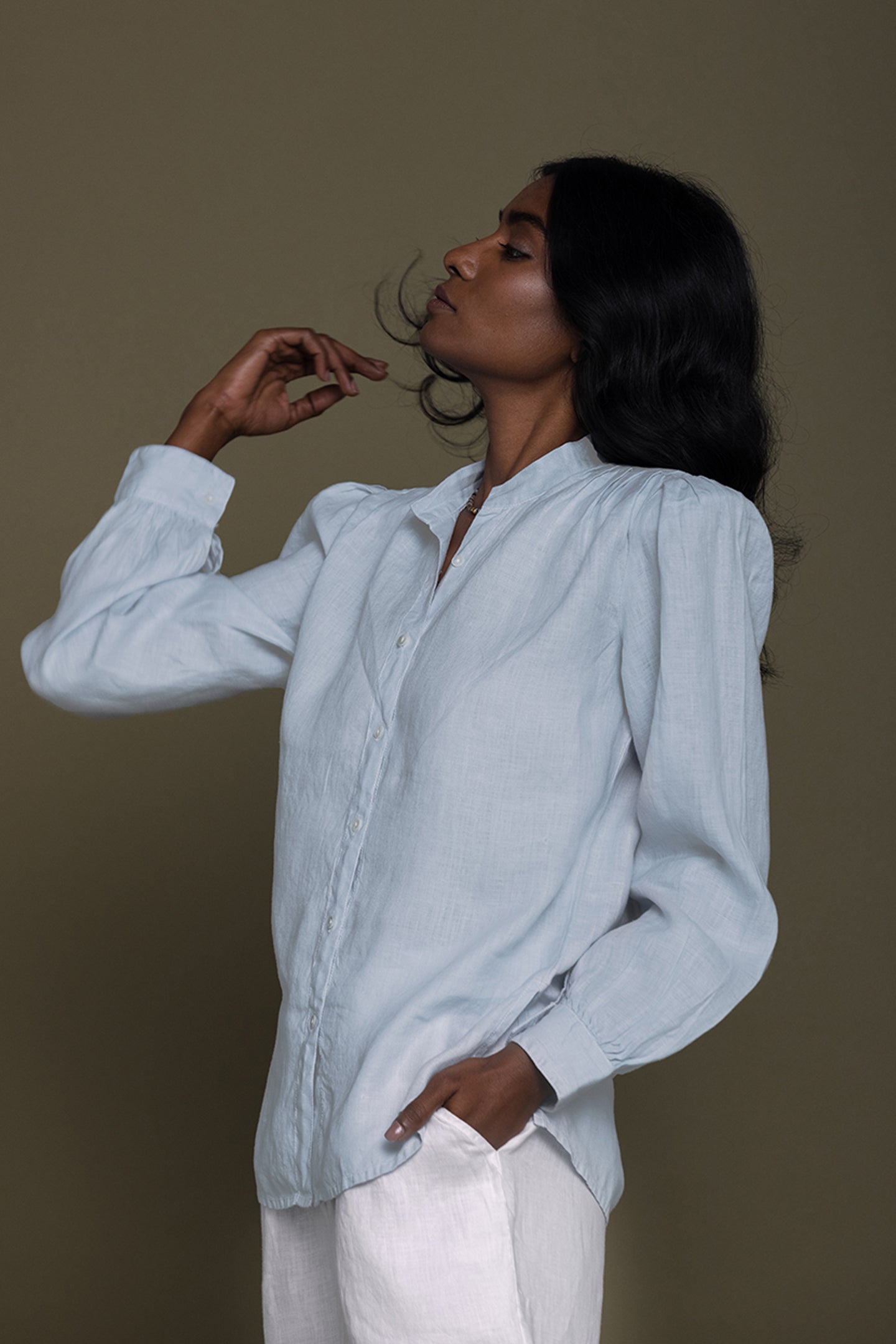 Model wearing Reistor Wild River Shirt in Blue featuring sustainable fabric, minimalist styling, relaxed tailoring and breathable comfort for every season.
