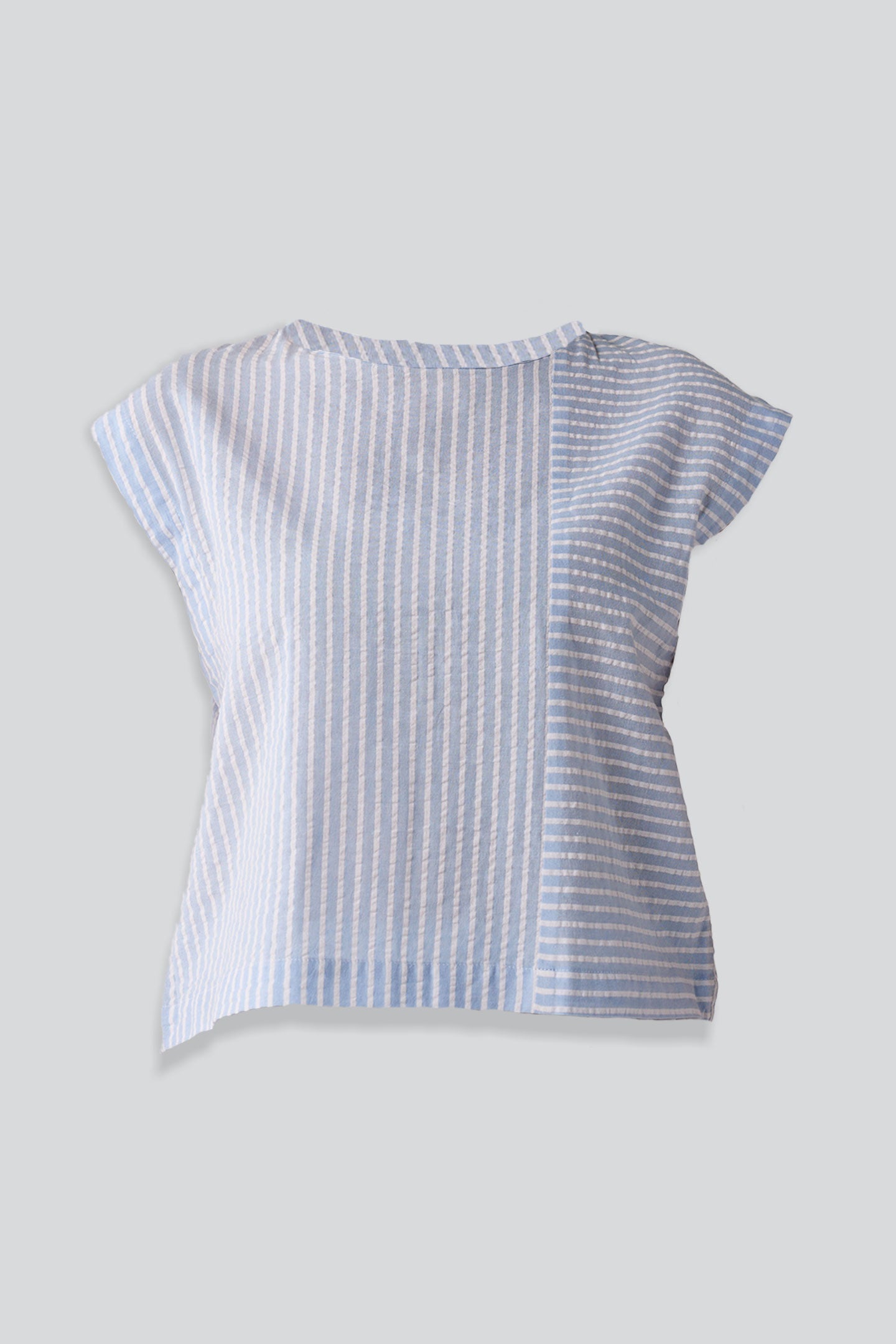 Blue and white striped shirt on a gray background