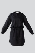 Black dress with a belt on a light gray background