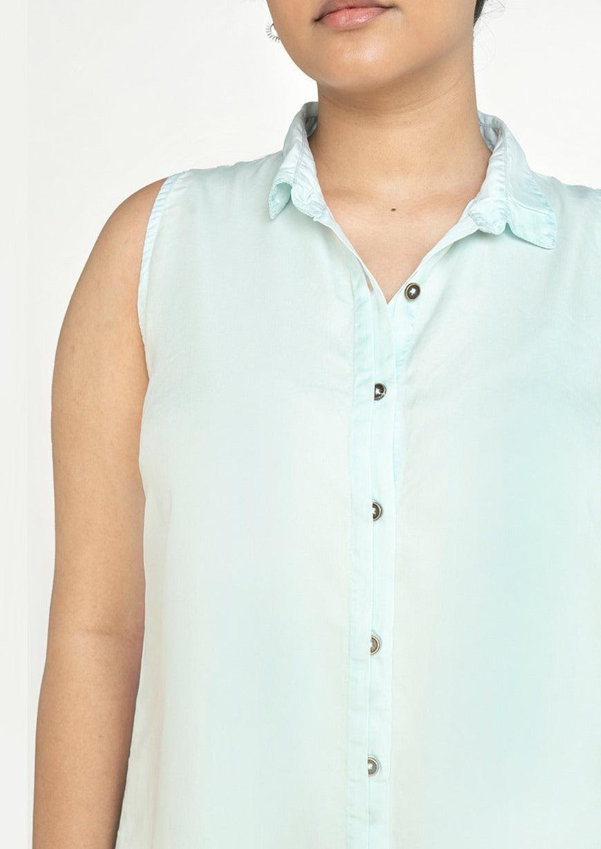 Close-up of Reistor Dreaming of Blue Skies Dress featuring a sleeveless collared neckline, button-front design, and soft sustainable fabric for everyday comfort.