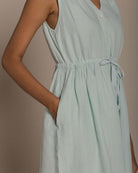 Reistor Pina Colada Season Dress in airy mint green with a cinched waist, pockets, and an effortless drape.