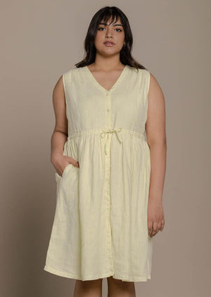 functional yellow sleeveless dress with a drawstring on the waist to give it more definition. 