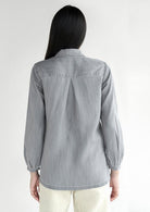 Back view of the Reistor Shades of Everyday Top in Stone Grey, featuring a relaxed silhouette, lightweight fabric and timeless everyday style for women.