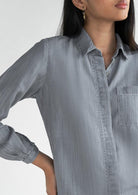 Close-up of the Reistor Shades of Everyday Top in Stone Grey, crafted from soft breathable fabric with a structured collar and chest pocket for everyday style. 
