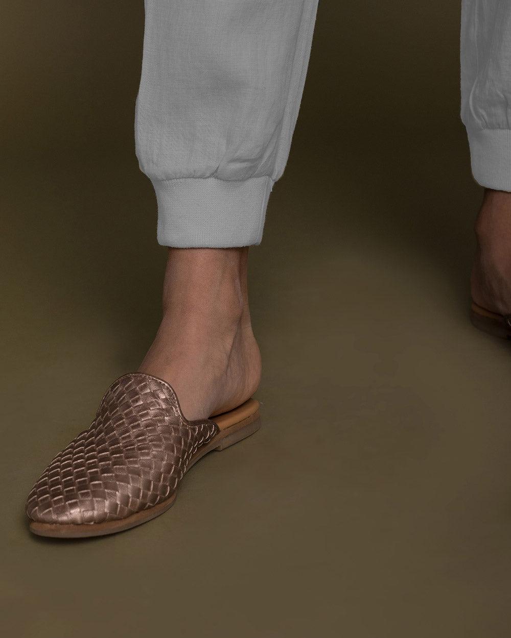 Detailed view of Reistor The Summer Sweats highlighting elastic ankle cuffs, soft natural fabric and comfortable tailoring for all-day movement and style. 