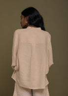 Beige top with flowy butterfly sleeves and a mandarin or Chinese collar