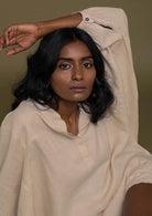 Beige top with flowy butterfly sleeves and a mandarin or Chinese collar