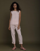 sleeveless pink top with side detailing. Reistor
