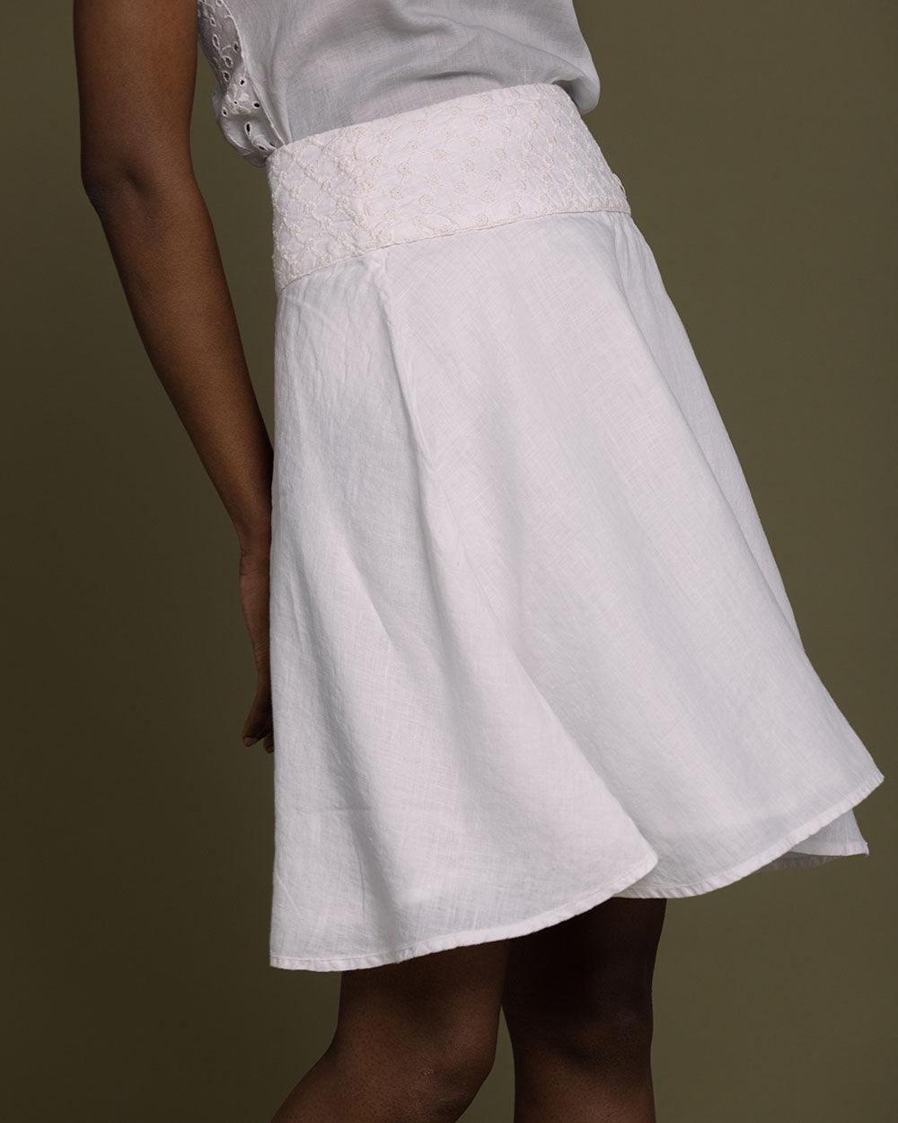 white straight comfort-fit skirt with an embroidered belt to accentuate the waistline.