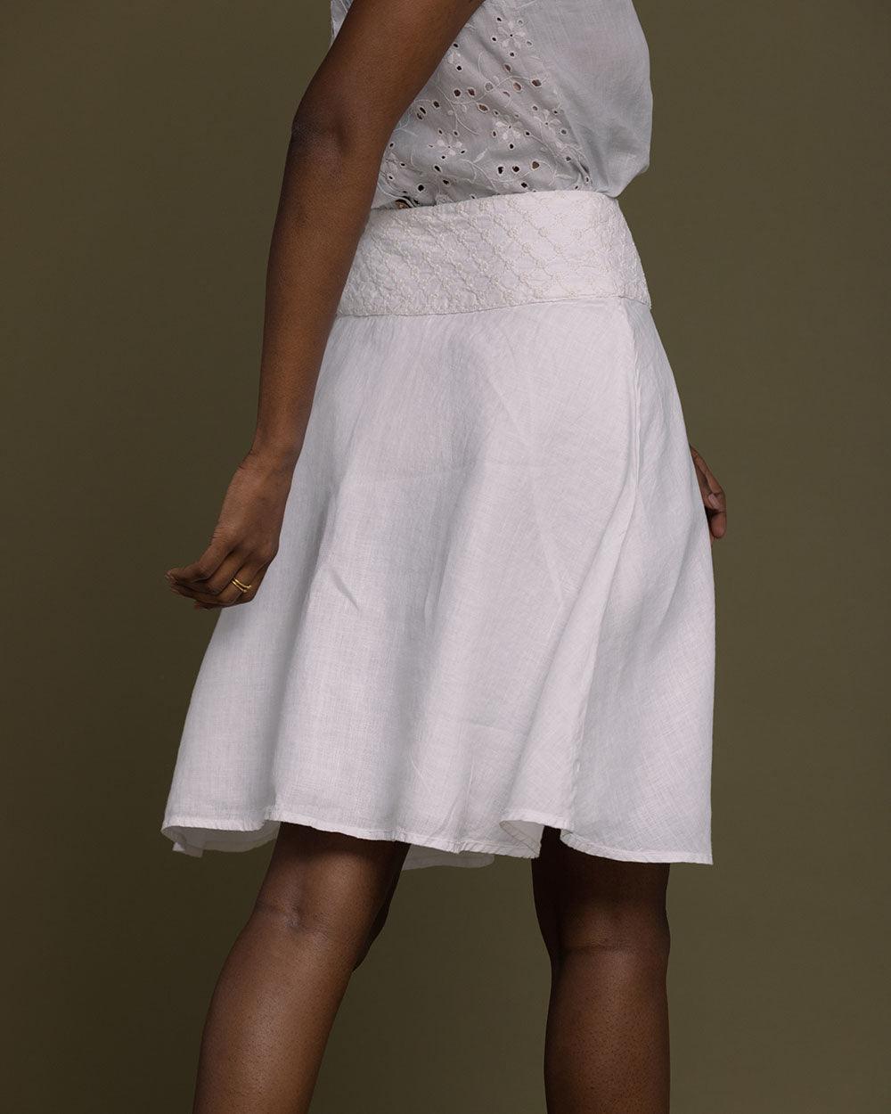 white straight comfort-fit skirt with an embroidered belt to accentuate the waistline.