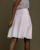 white straight comfort-fit skirt with an embroidered belt to accentuate the waistline.