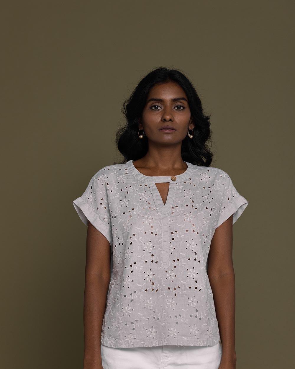 cloud greyembroidered top with side pockets.