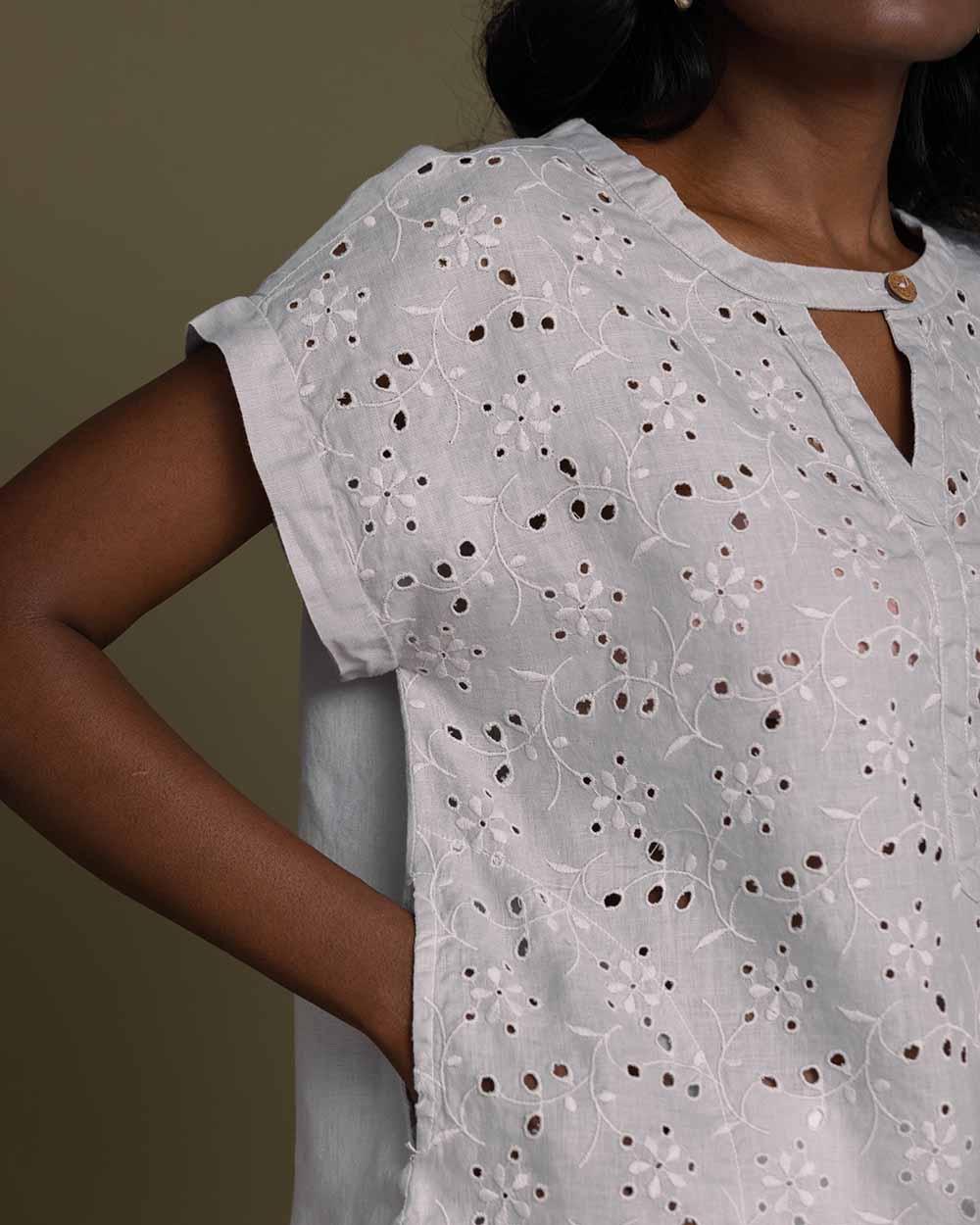 cloud greyembroidered top with side pockets.