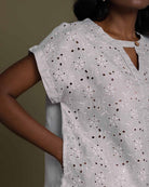 cloud greyembroidered top with side pockets.