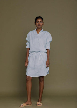 soft blue shirt dress with full sleeves and a drawstring at the waist to give it more definition 