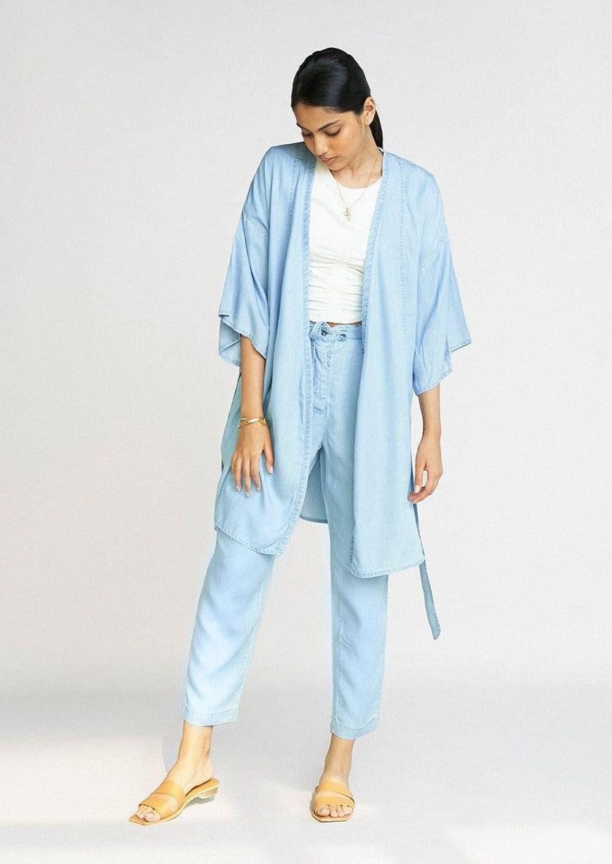 Front view of the Reistor Wrapped in Happiness Overlay in Ocean Blue, designed with a flowing silhouette, lightweight fabric and refined contemporary layering style.